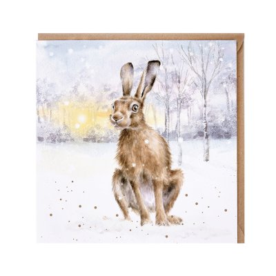 Hare in a snowy field illustrated Christmas card